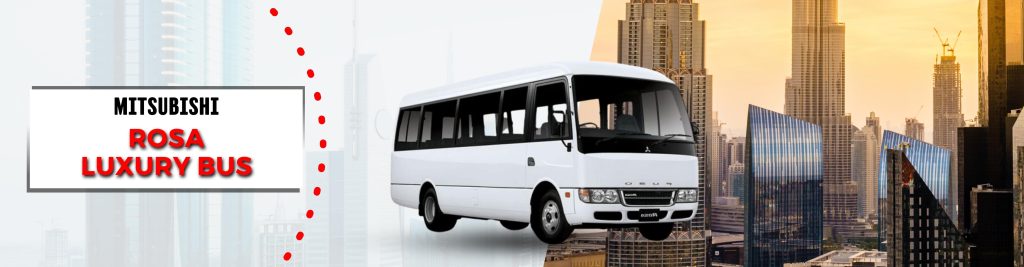 Mitsubishi Rosa luxury tourist bus with a sleek white exterior, displayed against a city skyline. The image highlights the vehicle's design, ideal for group travel and comfortable journeys across the city.